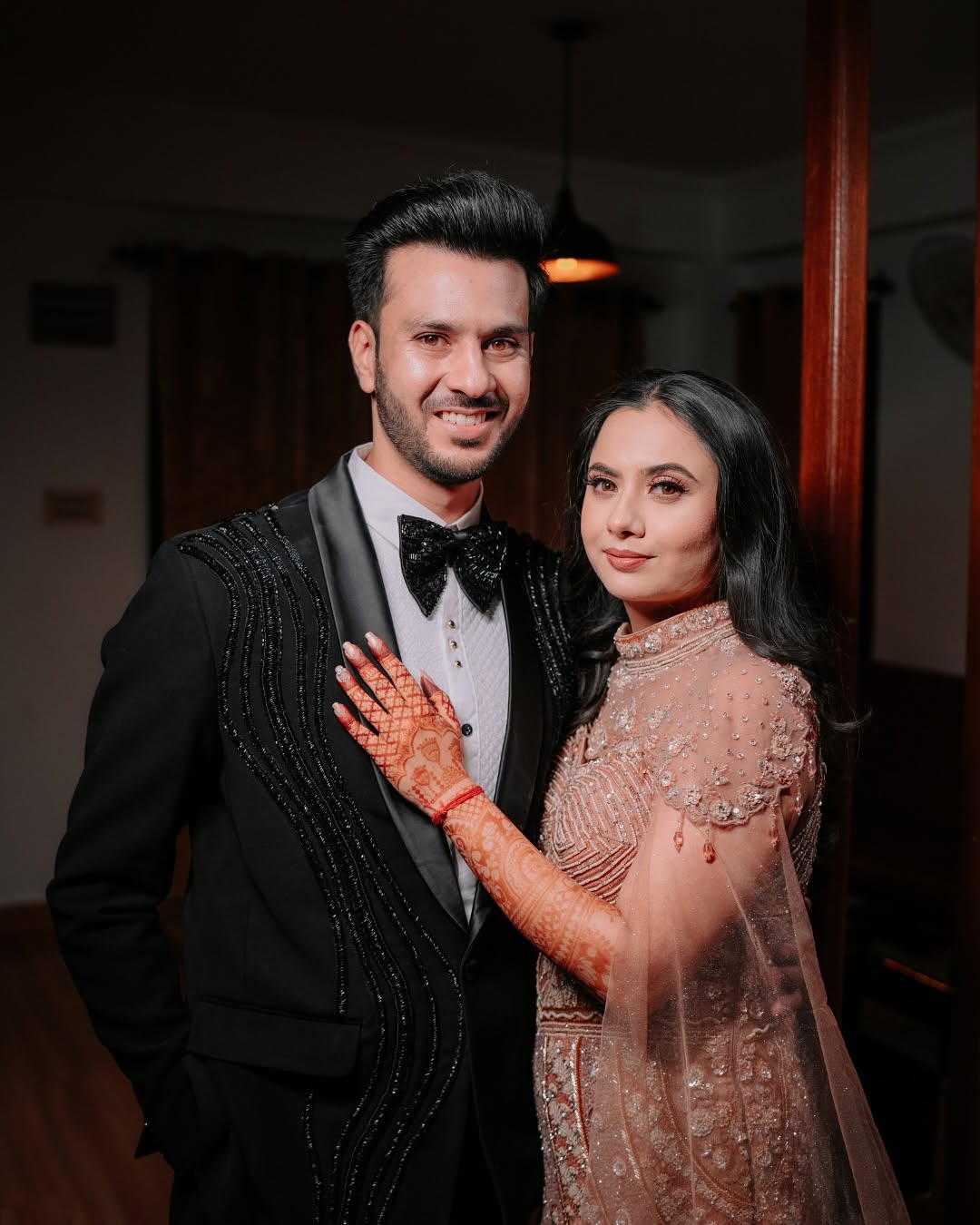Couple at the reception in tuxedo and gown