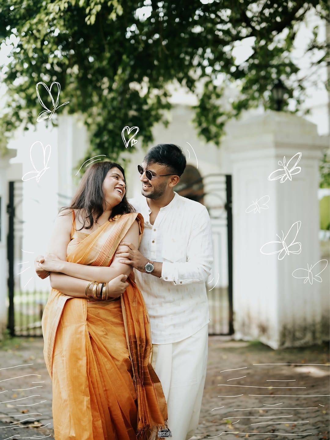A candid laughing moment between the couple